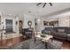 Elegant living room featuring hardwood floors, stylish furniture, and an inviting open layout at 1916 E Dubois Ave, Gilbert, AZ 85298