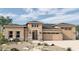 Charming single-story home featuring a neutral color scheme, a two-car garage, and inviting curb appeal at 19933 W Marshall Ave, Litchfield Park, AZ 85340