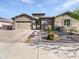 Charming single-Gathering home featuring a two-car garage, stone accents, and desert landscaping at 20075 E Kestrel St, Queen Creek, AZ 85142