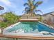 Inviting backyard hot tub with a wooden surround, set against a backdrop of lush landscaping at 20075 E Kestrel St, Queen Creek, AZ 85142
