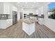 Bright, modern kitchen featuring stainless steel appliances, granite countertops, and an island at 20075 E Kestrel St, Queen Creek, AZ 85142