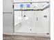 This remodeled bathroom has a sleek glass shower with a built-in bench and tile accents at 20075 E Kestrel St, Queen Creek, AZ 85142