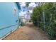 Gravel backyard featuring perimeter fencing, mature landscaping, and a utility area, perfect for outdoor enjoyment at 201 S Greenfield Rd # 144, Mesa, AZ 85206