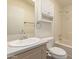 Bathroom featuring a single sink vanity, a large mirror, and a bath tub at 201 S Greenfield Rd # 144, Mesa, AZ 85206