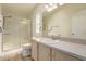 Bathroom featuring a glass enclosed shower, single sink vanity and a large mirror at 201 S Greenfield Rd # 144, Mesa, AZ 85206
