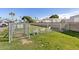 Community dog park features a grassy area, fencing, and seating for pet owners at 201 S Greenfield Rd # 144, Mesa, AZ 85206
