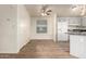 Open layout kitchen with white appliances, sleek countertops, and natural light over the dining area at 201 S Greenfield Rd # 144, Mesa, AZ 85206