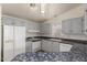 Well-lit kitchen featuring painted cabinets, white appliances, and updated countertops at 201 S Greenfield Rd # 144, Mesa, AZ 85206