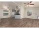Inviting open-concept living space with wood-look floors, connecting living and dining areas at 201 S Greenfield Rd # 144, Mesa, AZ 85206