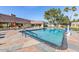 Large community pool featuring cool blue water and a spacious deck with tables and chairs at 201 S Greenfield Rd # 144, Mesa, AZ 85206