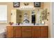 Spacious bathroom featuring a double vanity, large mirror, and a separate area with a tub at 2055 W Jasper Butte Dr, Queen Creek, AZ 85144