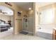 Bright bathroom features a walk-in shower, soaking tub, and neutral colors to create a serene retreat at 2055 W Jasper Butte Dr, Queen Creek, AZ 85144