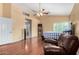 Bright bedroom with hardwood floors, vaulted ceilings, and natural light at 2131 E New Bedford Dr, Gilbert, AZ 85234
