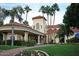 Upscale clubhouse with porte cochere entry surrounded by tall palm trees and professional landscaping at 2131 E New Bedford Dr, Gilbert, AZ 85234