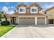 Charming two-story home with a three-car garage and a beautiful red tile roof at 2131 E New Bedford Dr, Gilbert, AZ 85234