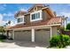 Two-story house with three-car garage and terracotta roof, set in a well-kept neighborhood at 2131 E New Bedford Dr, Gilbert, AZ 85234