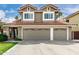 Two story house with a three-car garage and attractive landscaping at 2131 E New Bedford Dr, Gilbert, AZ 85234