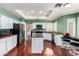 Bright kitchen features white cabinetry, stainless steel appliances, and granite countertops at 2131 E New Bedford Dr, Gilbert, AZ 85234