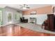 Cozy living room features a work area, wood floors, and neutral tones at 2131 E New Bedford Dr, Gilbert, AZ 85234