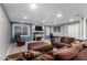 Cozy finished basement with a TV, fireplace, comfortable sectional, and windows at 2131 E New Bedford Dr, Gilbert, AZ 85234