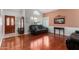 Living room featuring hardwood floors, soaring ceilings, and a lovely arch window at 2131 E New Bedford Dr, Gilbert, AZ 85234