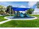 Community playground with modern play structures and a safety surface for children at 2131 E New Bedford Dr, Gilbert, AZ 85234