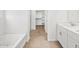 Primary bathroom featuring bathtub and separate walk-in closet at 24493 W Grenadine Rd, Buckeye, AZ 85326