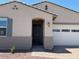 Charming single-story home featuring a neutral color palette, manicured gravel yard, and an attached two-car garage at 24493 W Grenadine Rd, Buckeye, AZ 85326