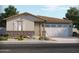 Charming single-story home features a two-car garage, stone accents, and desert landscaping at 24501 W Grenadine Rd, Buckeye, AZ 85326