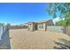 The backyard features a desert rock landscape and block wall fencing at 25755 W Hazel Dr, Buckeye, AZ 85326