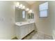 Bright bathroom features a dual sink vanity, tiled flooring, and a shower-tub combo at 25755 W Hazel Dr, Buckeye, AZ 85326