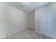 An empty bedroom with tile floors and neutral-painted walls at 25755 W Hazel Dr, Buckeye, AZ 85326