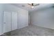 A bedroom features carpeted flooring, neutral paint, and a closet at 25755 W Hazel Dr, Buckeye, AZ 85326