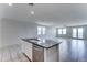 Bright and airy living room featuring tile floors, multiple windows, and a glass doors providing access to the backyard at 25755 W Hazel Dr, Buckeye, AZ 85326