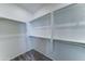 Walk-in closet with built-in shelving and ample storage space for organization at 25755 W Hazel Dr, Buckeye, AZ 85326