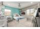 Bright bedroom featuring an accent wall, carpeted floor, natural light, and a ceiling fan at 2605 W Golden Puma Trl, Phoenix, AZ 85085