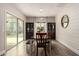 Bright dining room with sliding door, accent wall, table, and matching chairs, perfect for Gathering gatherings at 2605 W Golden Puma Trl, Phoenix, AZ 85085