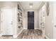 Bright and airy entryway featuring hardwood floors and decorative wall shelves at 2605 W Golden Puma Trl, Phoenix, AZ 85085