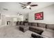 Upstairs Gathering area featuring a sectional sofa, wet bar, carpeted floors, and ceiling fans at 2605 W Golden Puma Trl, Phoenix, AZ 85085