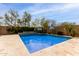 Backyard pool featuring a basketball hoop and an umbrella for shade at 2605 W Golden Puma Trl, Phoenix, AZ 85085