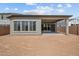 Expansive backyard featuring a covered patio and large windows for ample natural light at 26079 S 228Th St, Queen Creek, AZ 85142