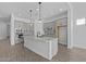 Modern kitchen featuring granite countertops, a large island, stainless steel appliances, and gray cabinetry at 26079 S 228Th St, Queen Creek, AZ 85142