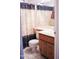 The bathroom is equipped with a toilet, vanity, and shower at 2738 E Libby St, Phoenix, AZ 85032