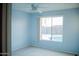 Sunny bedroom featuring blue walls, light carpet and a bright window at 2738 E Libby St, Phoenix, AZ 85032