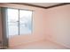Bright bedroom featuring neutral carpet and light pink walls at 2738 E Libby St, Phoenix, AZ 85032