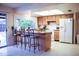 The kitchen area features a breakfast bar and appliances, and there is also a sliding door to the exterior at 2738 E Libby St, Phoenix, AZ 85032