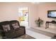 The living room has a sofa, a TV, and decorative elements, providing a comfortable place to relax at 2738 E Libby St, Phoenix, AZ 85032