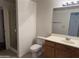 Bathroom features a vanity, mirror, toilet, and glass shower door at 3330 S Gilbert Rd # 1003, Chandler, AZ 85286
