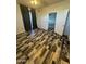 Bedroom featuring an open door to the exterior, a ceiling fan, and modern flooring at 3330 S Gilbert Rd # 1003, Chandler, AZ 85286