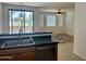 Kitchen featuring stainless steel appliances, plenty of counter space, and a view to the living area, great for entertaining at 3330 S Gilbert Rd # 1003, Chandler, AZ 85286